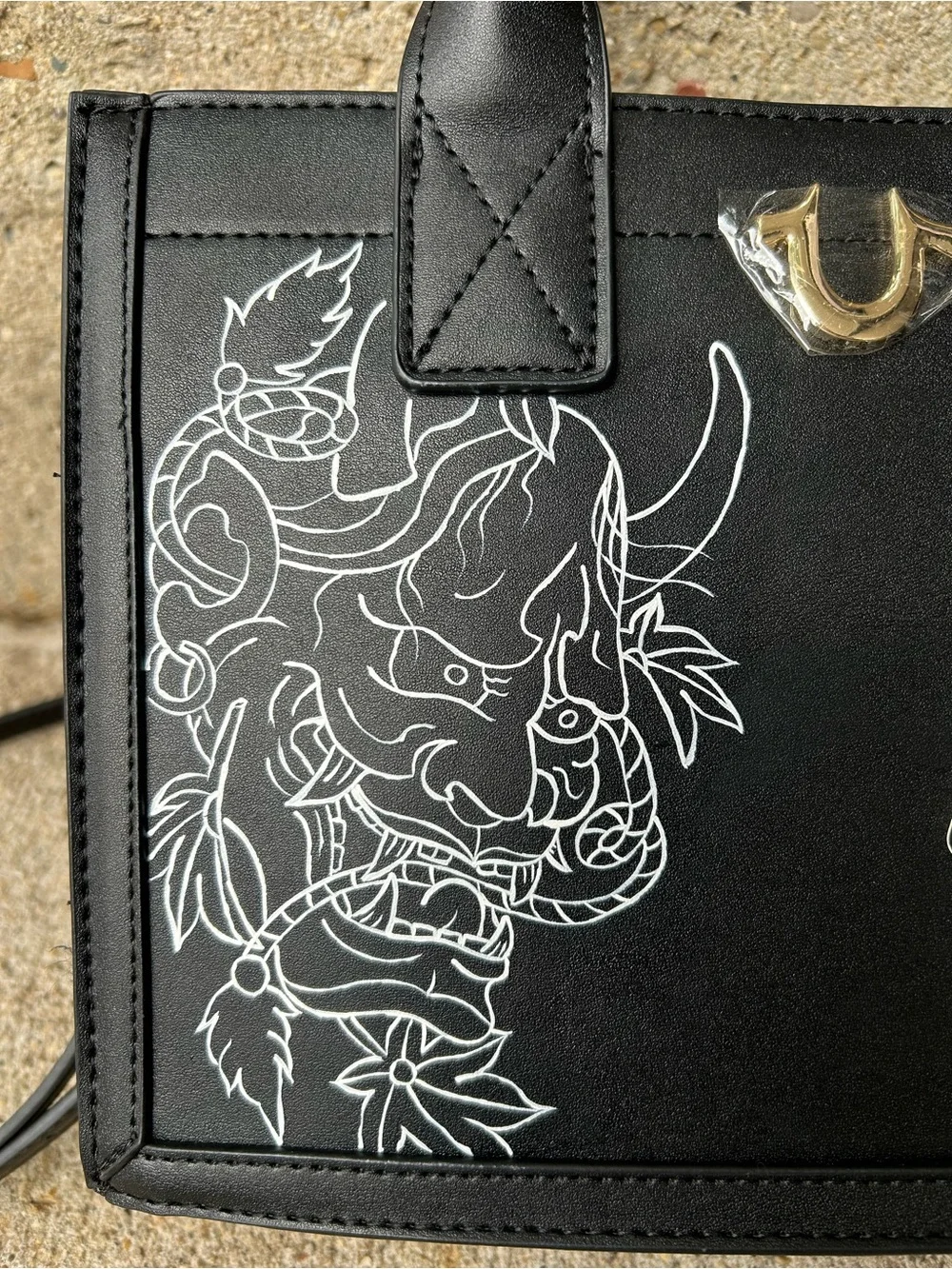 True Religion Black Satchel with White Graphic Demon Motif